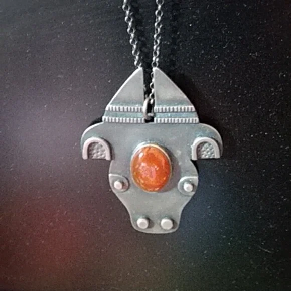 Amber stone bull pendant